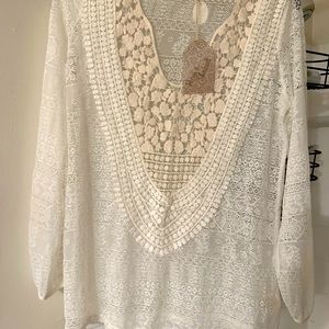 Hem and thread size small cream colored sheer blouse.  Brand new w/tag